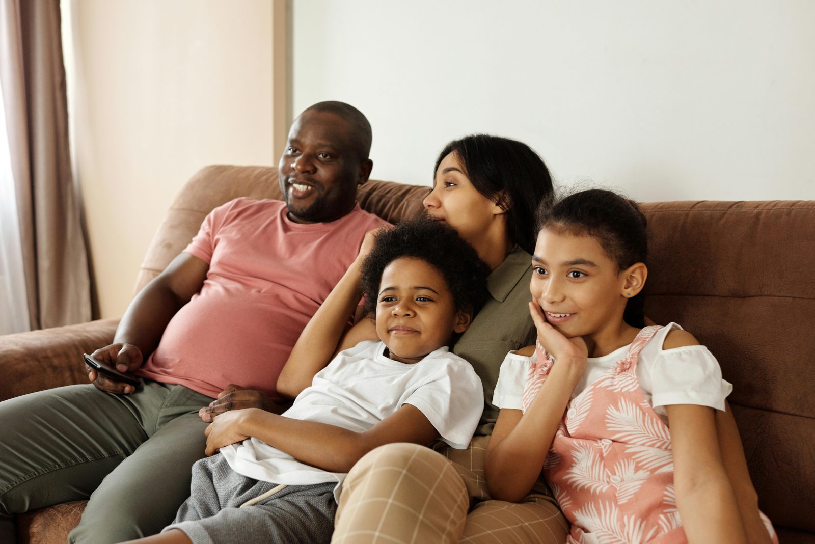 A family watching television together at home